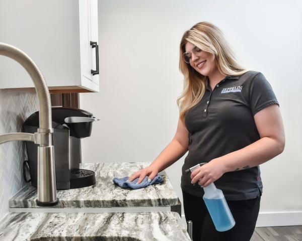 woman performing office cleaning services