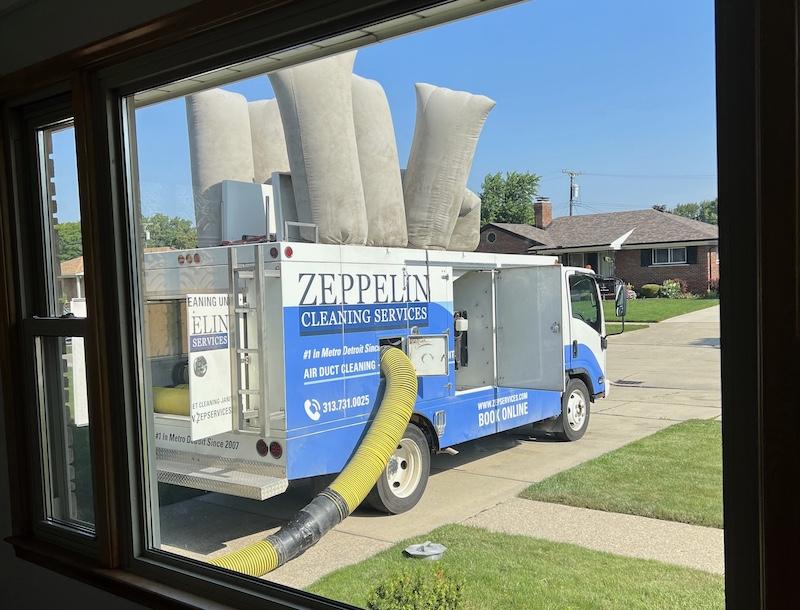 A Zeppelin truck executing air duct cleaning outside a Grosse Pointe Home